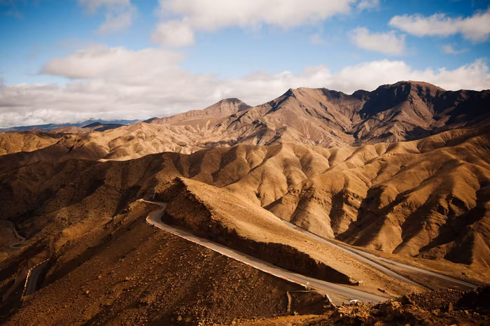 A road winding through the High Atlas Mountains near Marrakech, Morocco
